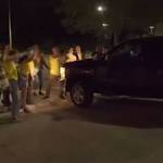 An correctional officer allegedly drove a truck into a group of Jewish peaceful protesters outside a detention center