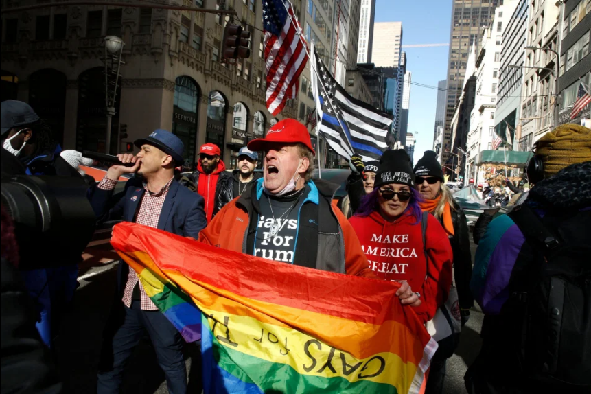 Trump fans clash with Antifa & BLM supporters after unfurling huge flag of Pelosi as a demon outside NYC’s Trump Tower