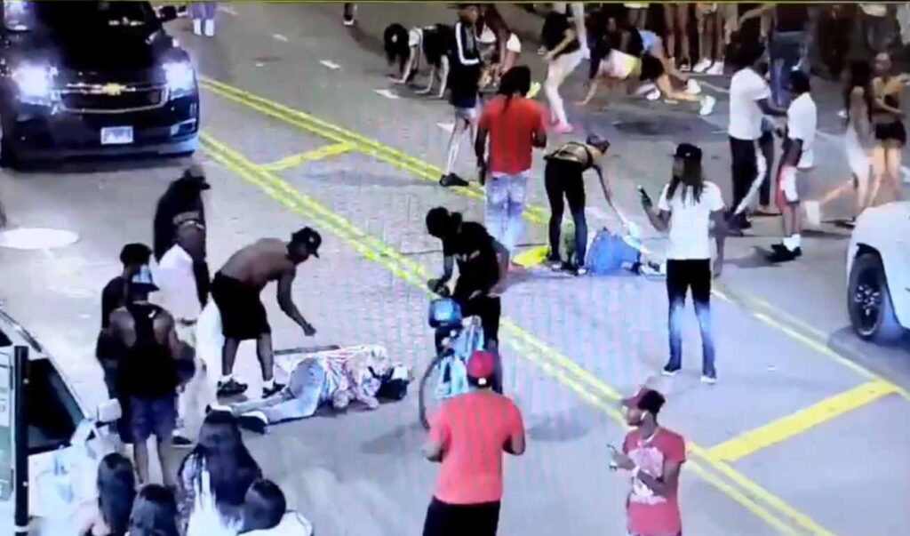 Two men are beaten and robbed in the middle of State Street as people walk by, drive past, and twerk up a storm (Video)