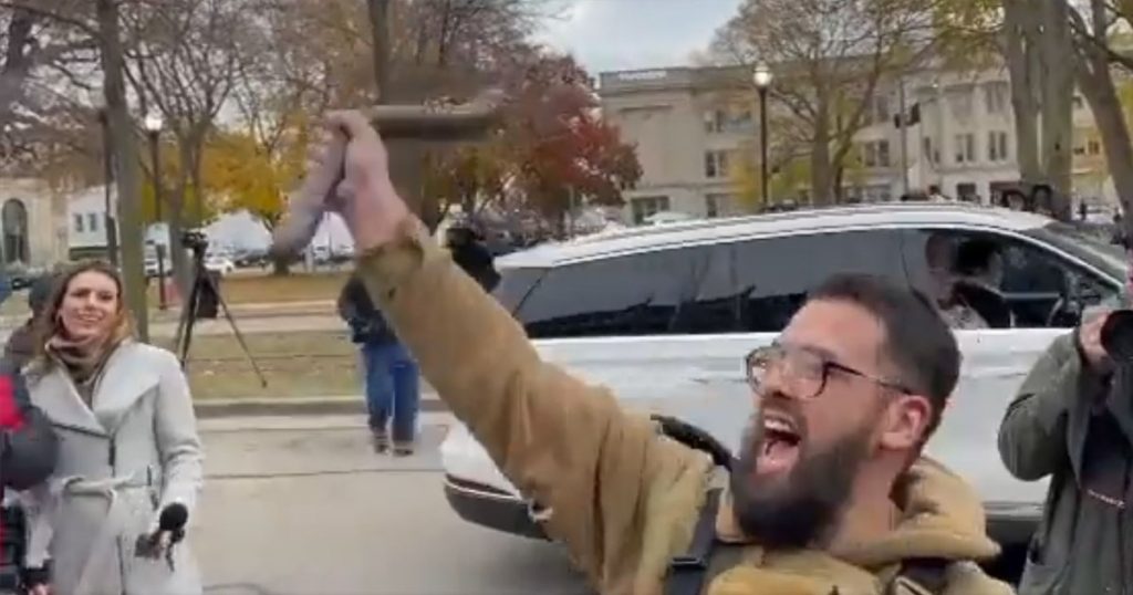 VIDEO: Man Retrieves Dildo From Rifle Case Outside Rittenhouse Trial Courtoom, Yells ‘F**k Black Lives Matter’