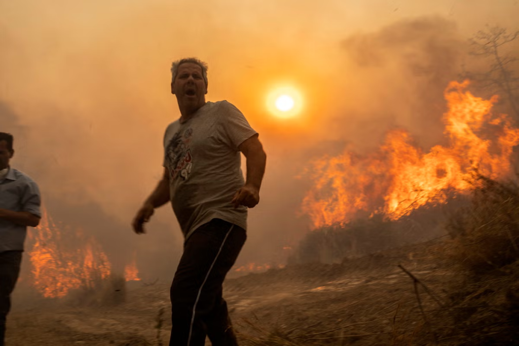 Greece fires – live: Rhodes state of emergency remains as flames reach outskirts of Athens