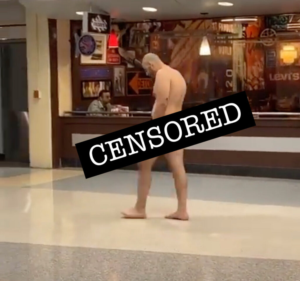 JOHN FETTERMAN DOPPELGÄNGER TRUDGES AU NATUREL THROUGH DFW AIRPORT