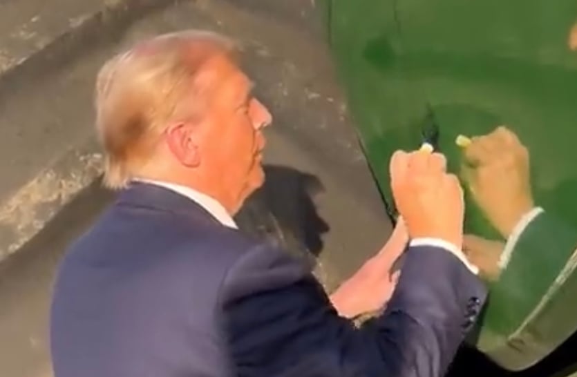 WATCH: Trump Autographs John Deere Combine In Iowa