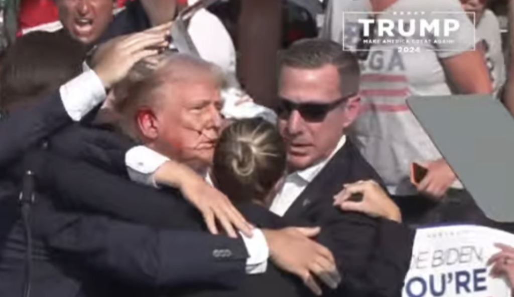 TRUMP SHOT, BLOOD ON EAR, 8 SHOTS HEARD