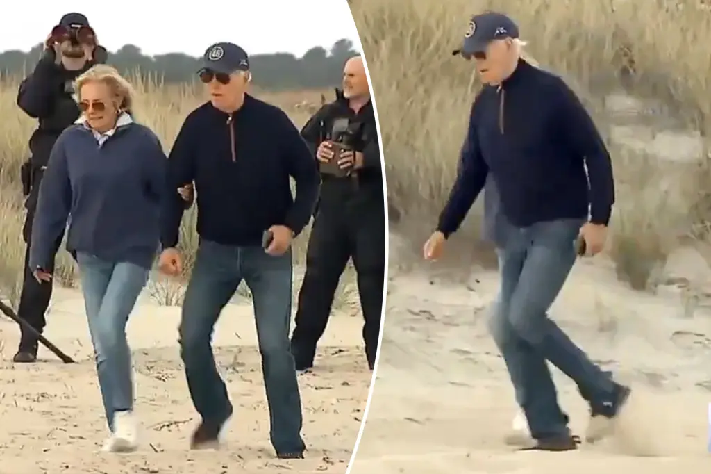 Biden stumbles multiple times — needs assist from Jill — as he struggles to walk on sandy Delaware beach