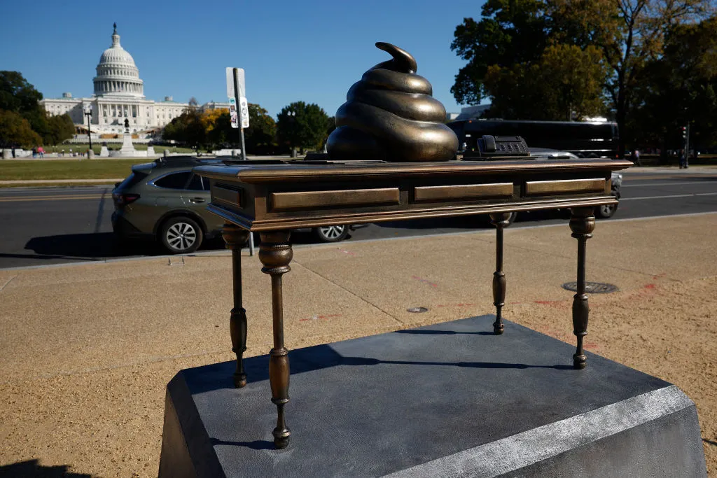 Pelosi Desk Covered in Poop and Trump Torch Sculptures Appear in D.C. Ahead of Election Day