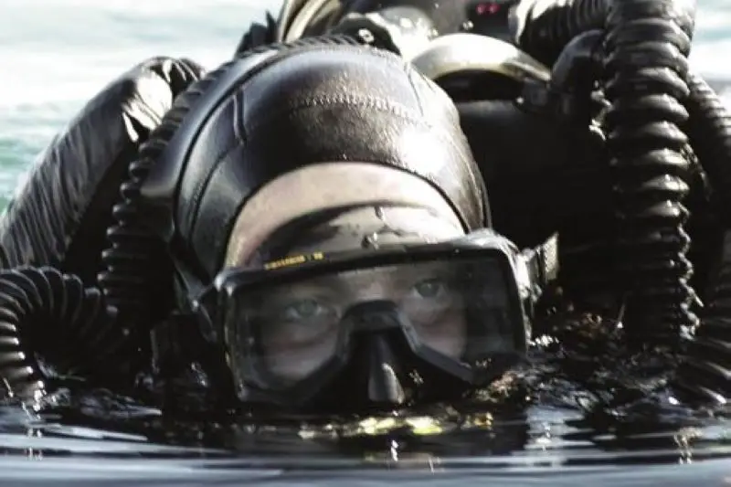 Divers prepare for underwater work near sunken tankers in the Kerch Strait