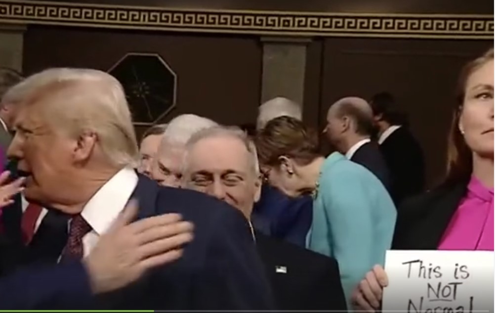 Democrat Flashes “This Is Not Normal” Sign When Trump Walks Into Chamber – Republican Lawmaker Takes it and Flings It into Air (VIDEO)