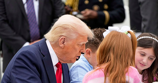 Scenes from the White House Easter Egg Roll: President and First Lady Color with Children