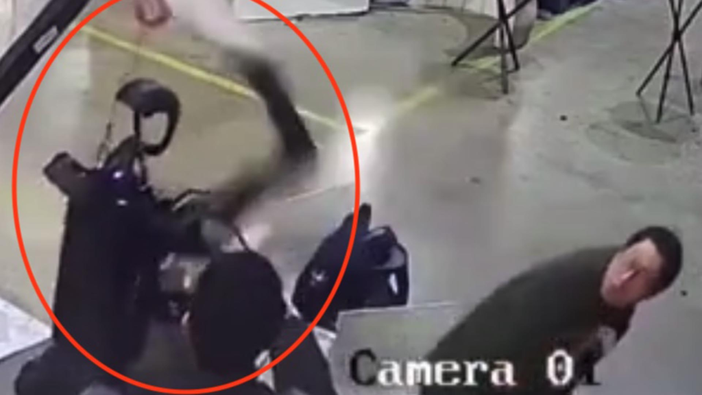 ASSAULT & BATTERY Haunting moment robot attacks handlers in angry rampage as it tries to break free from restraints in ‘dystopian scenes’
